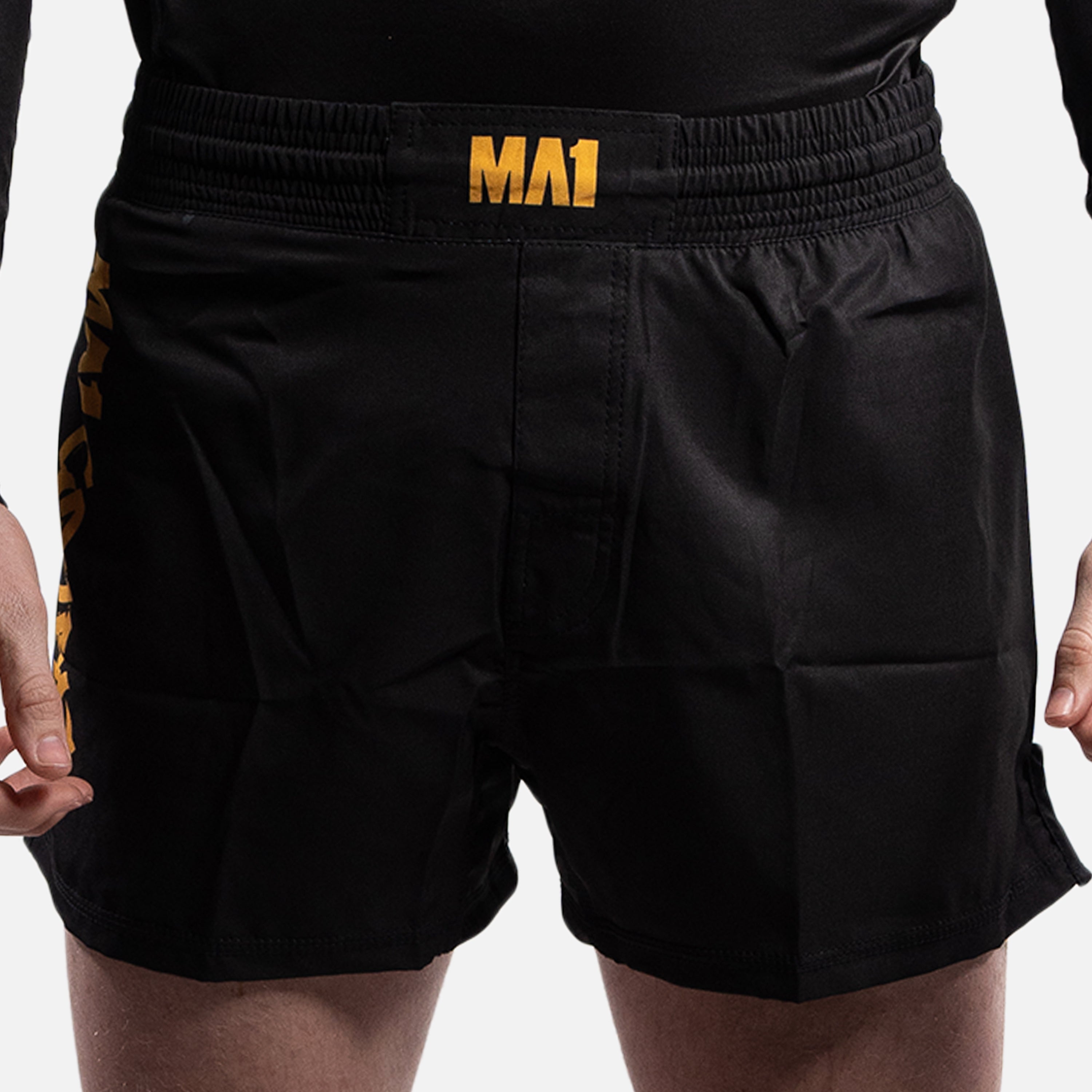 MA1 COMBAT BLACK AND GOLD MMA SHORTS