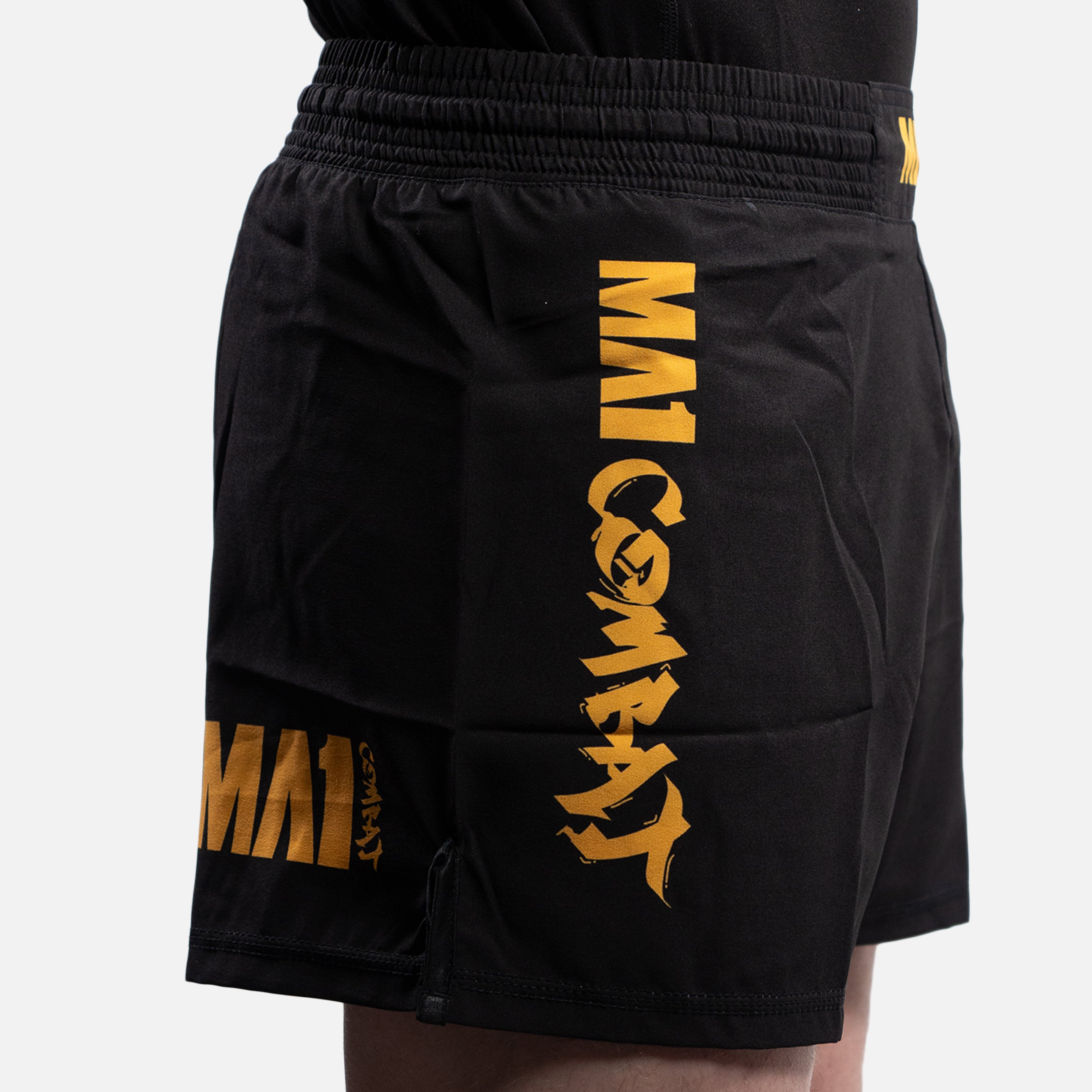 MA1 COMBAT BLACK AND GOLD MMA SHORTS